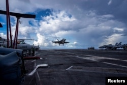 FILE - An F/A-18F Super Hornet prepares to land on the flight deck of the U.S. Navy Nimitz-class aircraft carrier USS Abraham Lincoln in the Pacific Ocean August 10, 2024. (U.S. Navy/Mass Communication Specialist Seaman Apprentice Daniel Kimmelman/Handout via REUTERS)