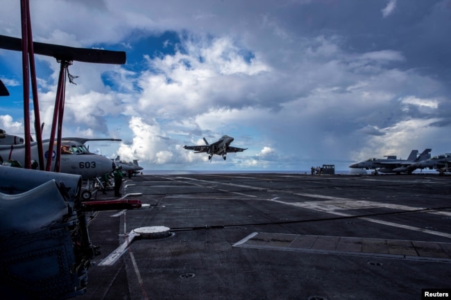 FILE - An F/A-18F Super Hornet prepares to land on the flight deck of the U.S. Navy Nimitz-class aircraft carrier USS Abraham Lincoln in the Pacific Ocean August 10, 2024. (U.S. Navy/Mass Communication Specialist Seaman Apprentice Daniel Kimmelman/Handout via REUTERS)