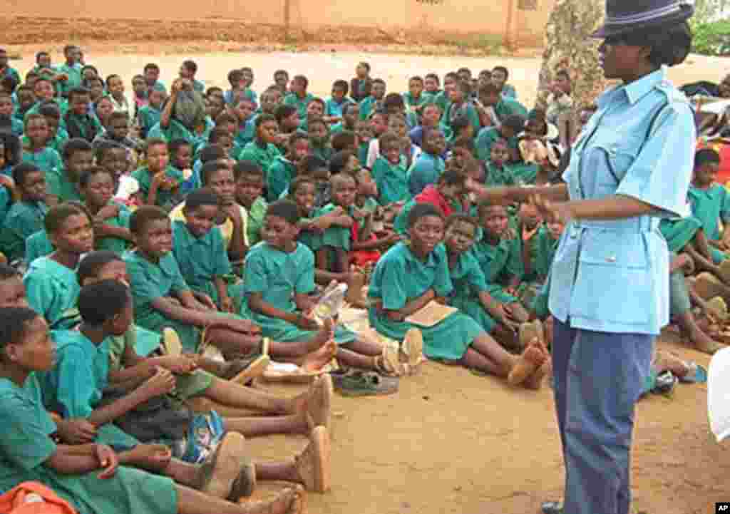 At a retreat for girls, a Malawi policewoman talks about life choices and her career. (Mathews Chavunya)
