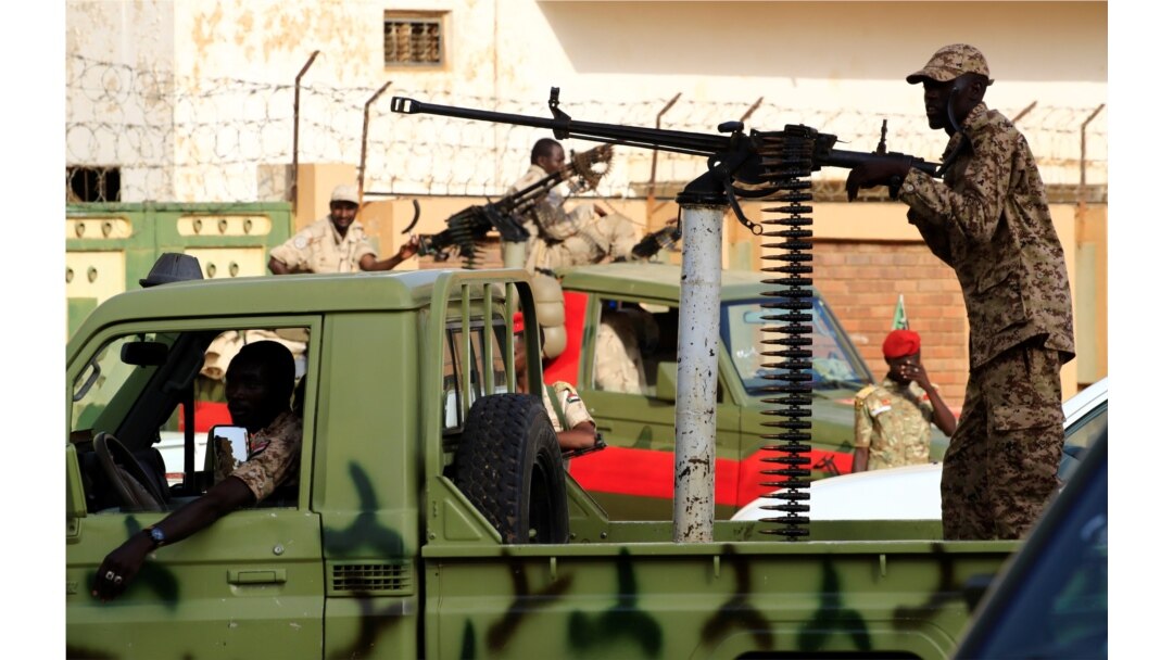 Sudanese soldiers secure the area as Sudan's ex-president Omar al-Bashir leaves the office of the anti-corruption prosecutor in Khartoum, Sudan, June 16, 2019.