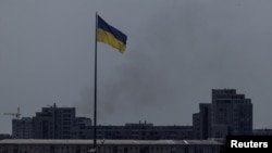 FILE - Smoke rises after Russian missile strikes, amid Russia's attack on Ukraine, in Kharkiv, Ukraine May 23, 2024.