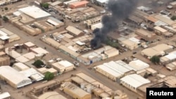 A view shows a fire at the industrial area given as Omdurman, Sudan, April 30, 2023, in this still image taken from video obtained by Reuters. 