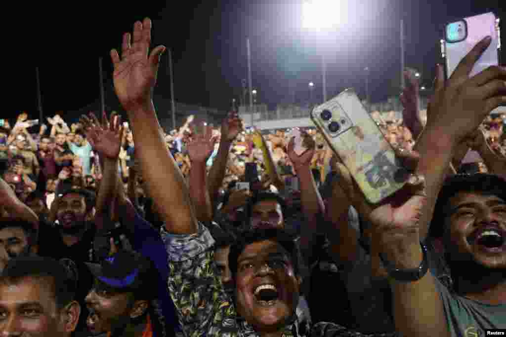 South Asian migrant workers cheer during New Year’s Eve celebrations at a migrant worker recreation center in Singapore, Dec. 31, 2024.