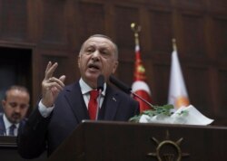 Turkey's President Recep Tayyip Erdogan addresses his ruling party's legislators, in Ankara, Jan. 14, 2020.