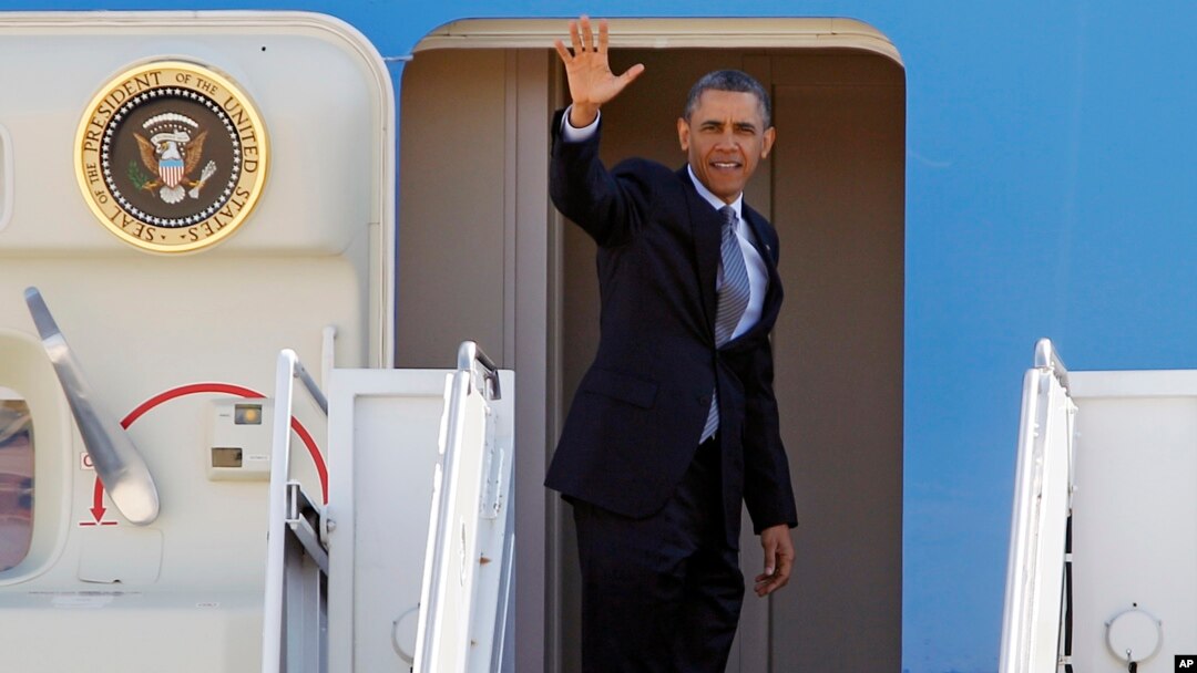 President Barack Obama waves prior to boarding Air Force One before departing form Andrews Air Force Base in Maryland, March. 15, 2013.