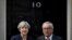 FILE - Britain's Prime Minister Theresa May welcomes Head of the European Commission, President Jean-Claude Juncker to Downing Street in London, April 26, 2017. 