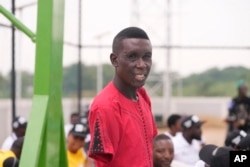 FILE— Lance Corporal, Dean Onuwchekwa, an Explosive Ordnance Disposal specialist whose upper half body was damaged in 2021 by an improvised explosive device he was trying to disarm in Borno state's attends an exhibition sitting volleyball match in Abuja Nigeria, May 11, 2024.