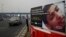 FILE - An anti-tobacco warning is seen on a road divider on the outskirts of New Delhi, India, Nov. 4, 2016.
