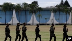 Soldiers patrol outside the president's official residence, Alvorada Palace, in Brasilia, Brazil, July 8, 2020. President Jair Bolsonaro said July 7 he tested positive for the coronavirus.