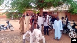 Parents of abducted children of the Salihu Tanko Islamic School wait for news on their children in Tegina, Nigeria, June 1, 2021. A number of students were abducted Sunday and one person was killed at a school in Nigeria's north central Niger State.