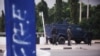FILE - Policemen guard the road to the Aso Villa, official residence of the President of Nigeria, during clashes between members of the Shi'ite Islamic Movement of Nigeria and the police, July 22, 2019. 