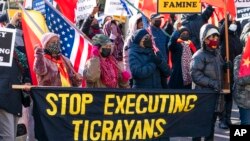 A group of Tigraian diaspora in North America protest about their conflict with Ethiopia, near the State Department, Dec. 22, 2021, in Washington.