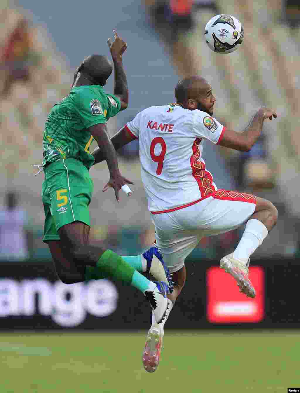 Guinea&#39;s Jose Kante in action with Zimbabwe&#39;s Gerald Takwara, Cameroon, Jan. 18, 2022.