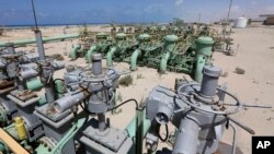 FILE - A general view of pipelines at the Zueitina oil terminal in Zueitina, west of Benghazi, April 7, 2014.