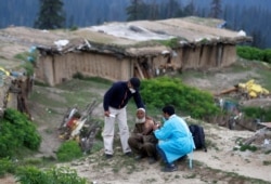 A shepherd man receives a dose of COVISHIELD, a coronavirus vaccine manufactured by Serum Institute of India, during a vaccination drive at Tosa Maidan in central Kashmir's Budgam district, June 21, 2021.
