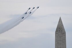 The U.S. Navy Blue Angels fly past the Washington Monument as President Donald Trump speaks during an Independence Day celebration in front of the Lincoln Memorial in Washington, July 4, 2019.