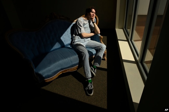 Grayson Hart sits for a portrait at the Ned R. McWherter West Tennessee Cultural Arts Center in Jackson, Tenn., on Saturday, March 4, 2023, where he directs a youth theater program. (AP Photo/Mark Zaleski)