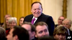 FILE - Las Vegas Sands Corp. Chief Executive and Republican donor Sheldon Adelson stands as he is recognized by President Donald Trump during a Medal of Freedom ceremony in the East Room of the White House in Washington, Nov. 16, 2018. 