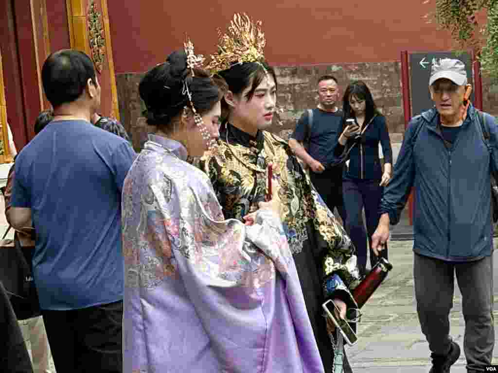Chinese woman visited the Forbidden City wearing traditional style costumes.