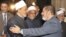 Egypt's President-elect Mohamed Morsi (R) shakes hand with Grand Sheikh of al-Azhar Ahmed El-Tayeb before Friday prayers at al-Azhar mosque, in the old quarter of Cairo, June 29, 2012.