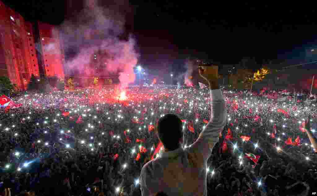 Republican People's Party (CHP) candidate for mayor of Istanbul Ekrem Imamoglu (C) celebrates a landmark win in front of thousands of supporters at Beylikduzu in Istanbul, Turkey, June 23, 2019.