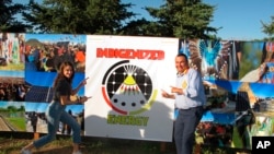 Actress Shailene Woodley poses with Cody Two Bears during the grand opening of a solar farm near Cannon Ball, N.D., on the Standing Rock Indian Reservation on Friday, July 26, 2019. 