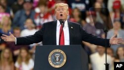 FILE - President Donald Trump speaks at a campaign rally in Duluth, Minn., June 20, 2018. Trump is heading back for a rally in Minnesota, where his presence could help boost some Republican congressional candidates but perhaps not others.