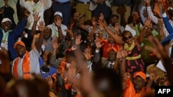 FILE - Opposition supporters react on Jan. 11, 2017, in the capital Nairobi, where leaders from at least 15 main opposition parties gathered to announce their new formed alliance against the President Uhuru Kenyatta and his deputy, William Ruto's-led ruling Jubille coalition in the Aug. 2017 national elections.