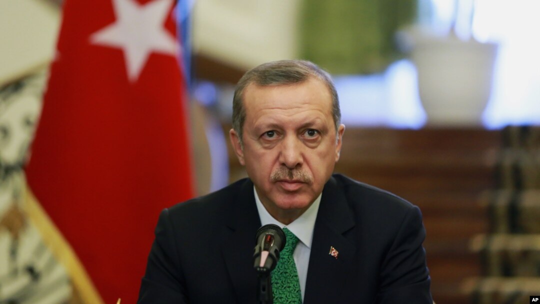 FILE - Turkish Prime Minister Recep Tayyip Erdogan attends a news briefing.