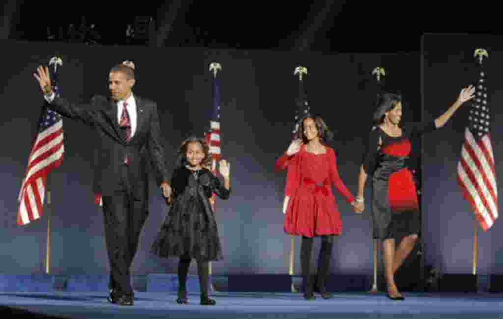 ** FILE ** In this Nov. 4, 2008 file photo, President-elect Barack Obama, left, his wife Michelle Obama, right, and two daughters, Malia, and Sasha, center left, wave to the crowd at the election night rally in Chicago. HBO has bought the U.S. rights to a