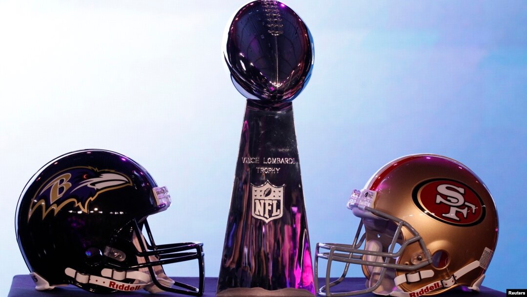 The helmets of the San Francisco 49ers and the Baltimore Ravens sit beside the Vince Lombardi trophy before a press conference ahead of the NFL's Super Bowl XLVII in New Orleans, Louisiana, Feb. 1, 2013. 