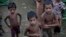 FILE - Rohingya children gather at the Dar Paing camp for Muslim refugees, north of Sittwe, western Rakhine state, Myanmar.