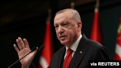 Turkish President Tayyip Erdogan talks during a news conference following a cabinet meeting in Ankara, Turkey, Nov. 30, 2020.