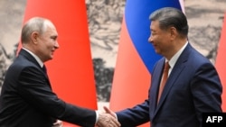 Ruski predsjednik Vladimir Putin i kineski predsjednik Xi Jinping u Pekingu 16. maja 2024.