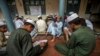 FILE - Pakistani religious students attend a lesson at Darul Uloom Haqqania, an Islamic seminary in Akora Khattak, Khyber Pakhtunkhwa province, Sept. 14, 2013. 