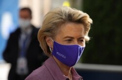 FILE - European Commission President Ursula von der Leyen arrives for an EU summit at the European Council building in Brussels, Oct. 15, 2020.