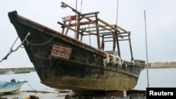 Unidentified wooden boat which was found in the sea off Noto Peninsula, is seen in Wajima, Japan, in this photo taken by Kyodo, Nov. 29, 2015.