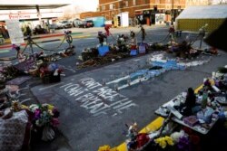 A memorial at the place where George Floyd died is seen while the city of Minneapolis enters its third day of the trial of Derek Chauvin, in Minneapolis, Minnesota, March 31, 2021.