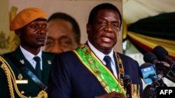 FILE: President Emmerson Mnangagwa delivers a speech during Independence Day celebrations at the National Sports Stadium on April 18, 2018 in Harare.   Zimbabwe on April 18 marked its first independence day without Robert Mugabe in power, with new leader Emmerson Mnangagwa vowing to hold "credible" elections and turn around the southern African country's moribund economy. / AFP PHOTO / Jekesai NJIKIZANA