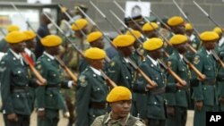 FILE: A soldier guards Zimbabwe's President Robert Mugabe, not seen, at the state funeral of Zimbabwe's Information Minister Tichaona Jakonya, who died Saturday at age 68, in Harare, Thursday, June 29, 2006. (AP Photo/Tsvangirayi Mukwazhi)