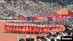 People attend a mass rally denouncing the U.S. in Pyongyang