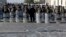 Iraqi riot police close a bridge leading to the heavily guarded Green Zone during a demonstration of followers of Iraq's influential Shiite cleric Muqtada al-Sadr in Baghdad, Iraq, Feb. 11, 2017.
