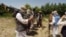 FILE - Taliban fighters are seen in an undisclosed location in Afghanistan, July 14, 2009.