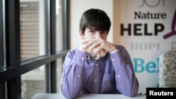 Danny Reagan, a former residential patient of the Lindner Center of Hope, sits in a common room at the center, in Mason, Ohio, Jan. 23, 2019.