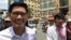 Yeang Sothearin (left) and Uon Chhin, former reporters for Radio Free Asia, walk out from the Phnom Penh Municipal Court, Phnom Penh, August 9, 2019. (Kann Vicheika/VOA Khmer)