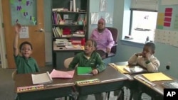 Children at a predominately African-American Islamic school in Balitmore listen and respond as police officer Robert Horne, Baltimore's Islamic liaison, speaks with the students about pertinent issues, February 2011