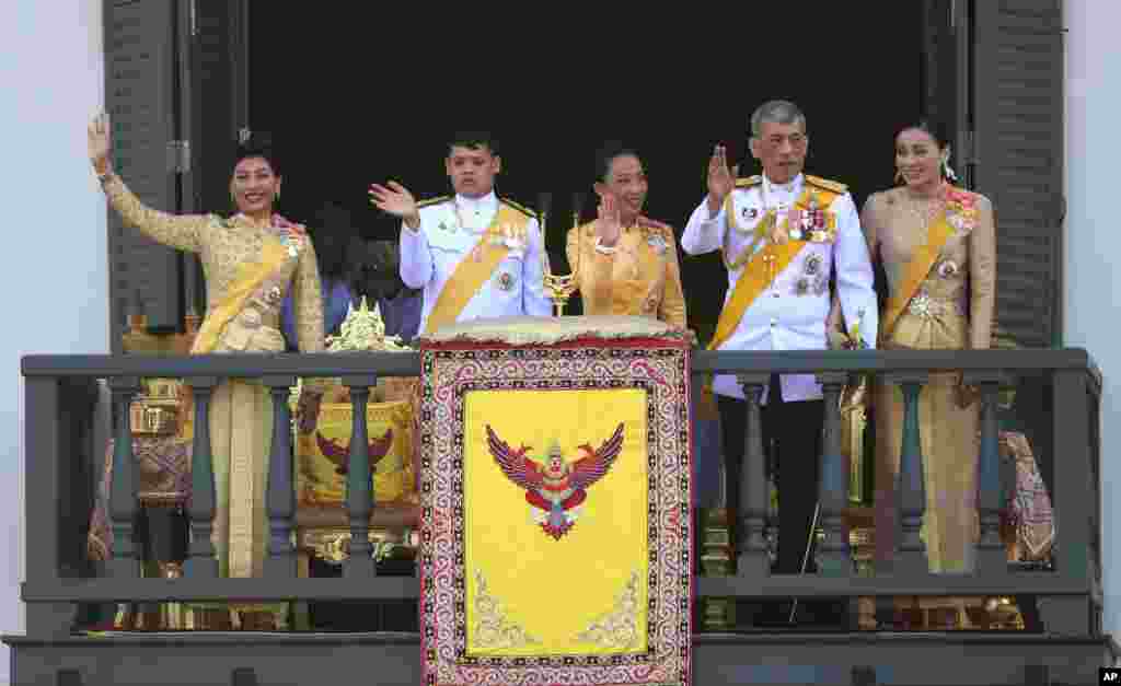 Thailand&#39;s royal family from left; Princess Sirivannavari Nariratana, daughter, Prince Dipangkorn Rasmijoti, son, Princess Bajrakitiyabha, daughter, King Maha Vajiralongkorn and Queen Suthida wave to an audience from the balcony of Suddhaisavarya Prasad Hall in the Grand Palace during the coronation ceremony in Bangkok.