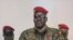 File - A screengrab taken from footage sent to AFP by a military source shows Guinean Colonel Mamady Doumbouya delivering a speech following the dissolution of the government during a coup in Conakry on September 5, 2021. 
