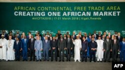 FILE - The African heads of states and governments pose during African Union (AU) Summit for the agreement to establish the African Continental Free Trade Area in Kigali, Rwanda, on March 21, 2018. (Photo by STR/AFP)