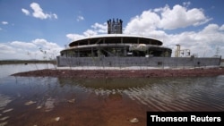 The base of a control tower at an abandoned construction site of a Mexico City airport that was scrapped two years ago sits flooded by summer rains, in Texcoco on the outskirts of Mexico City, Mexico, Sept. 3, 2020.